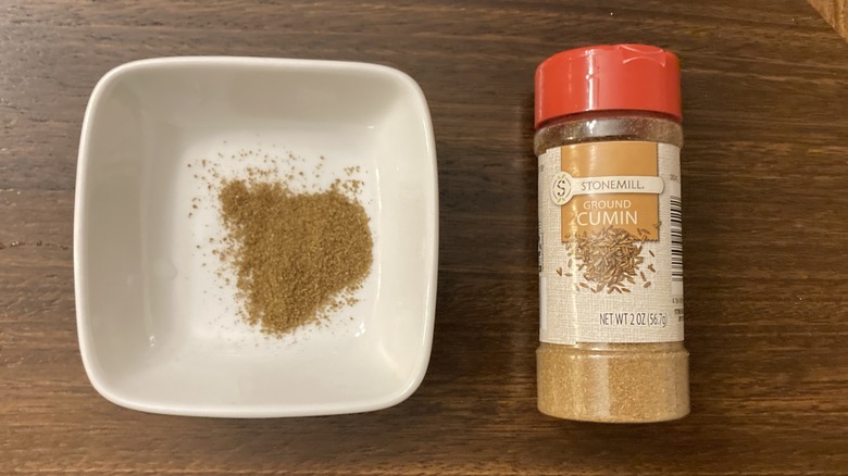 Stonemill Ground Cumin from Aldi in a small dish, next to the jar