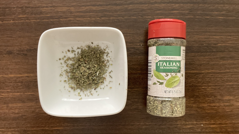 Stonemill Italian Seasoning in a small dish, next to the jar