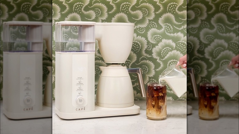 White Café coffee machine sitting on top of a counter