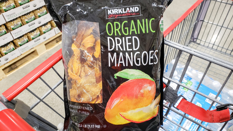 bag of Kirkland Signature dried mangoes in a cart