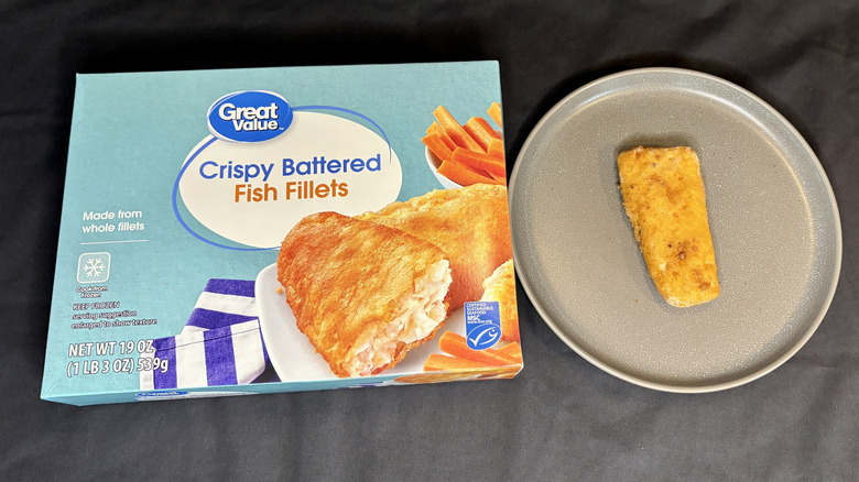 Battered fish fillet next to Great Value box