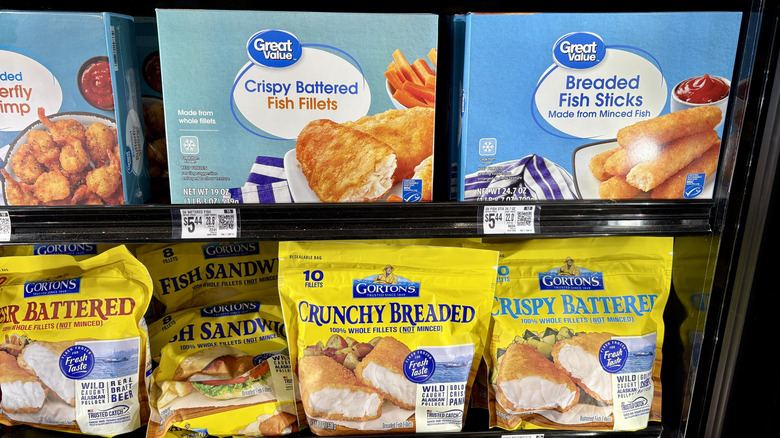 Breaded seafood boxes and bags on freezer shelf