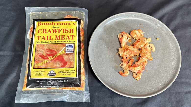 Crawfish meat on plate next to package