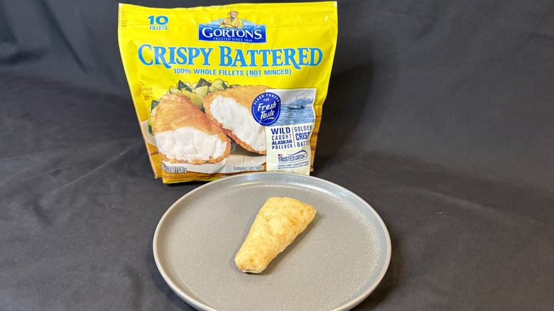 Breaded fish fillet in front of Gorton's packaging