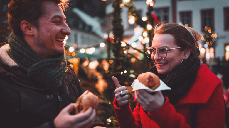 people eating outside during christmas