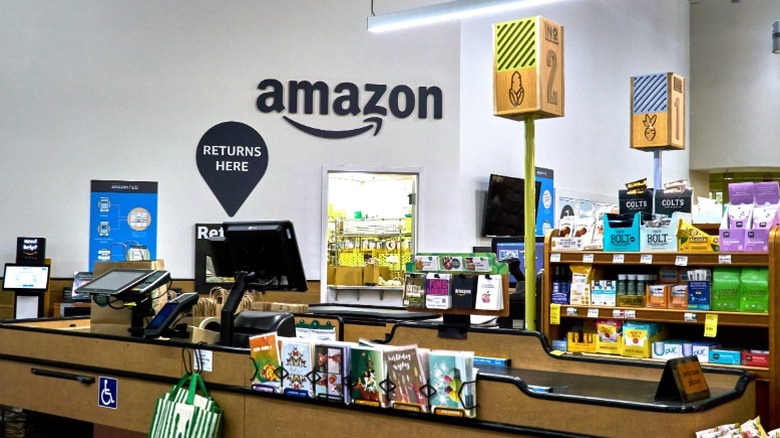 Whole Foods checkout lanes with Amazon logo in background