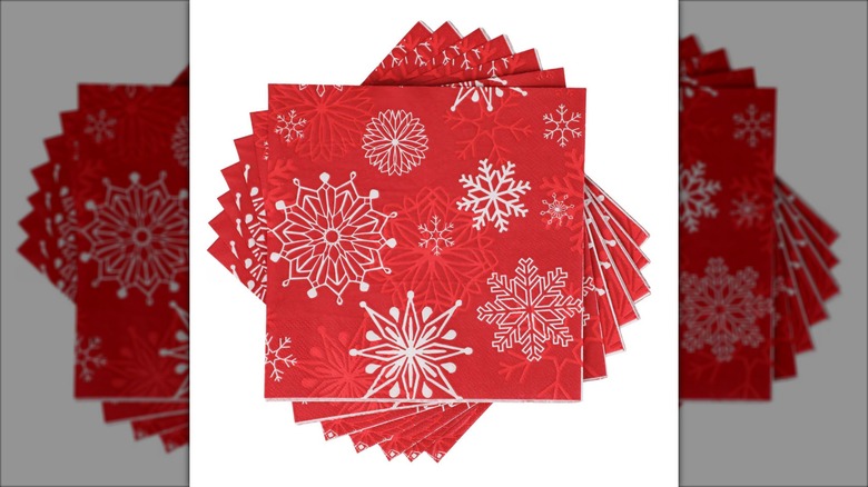 Stack of red napkins with white snowflakes