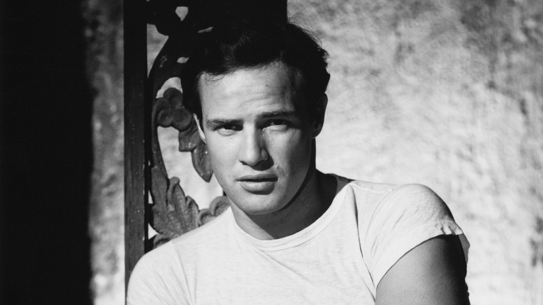 Hollywood screen legend Marlon Brando looks at camera in black and white photo