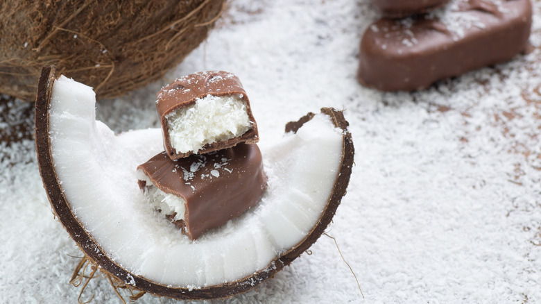 split coconut wedge with with Mounds bar split in half sitting on top