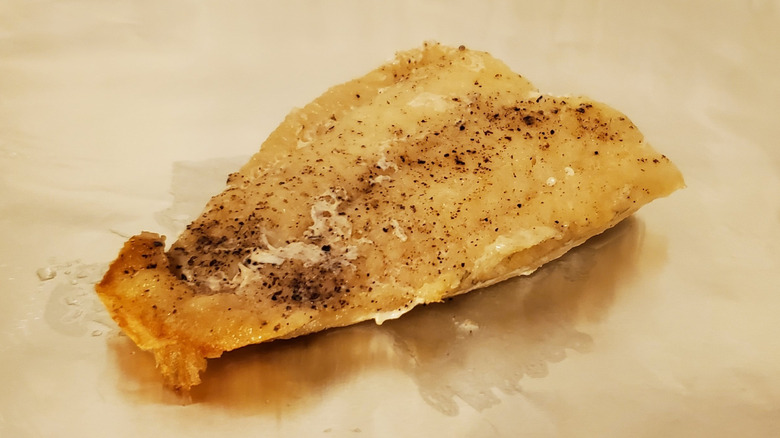 A cod fillet with salt and pepper