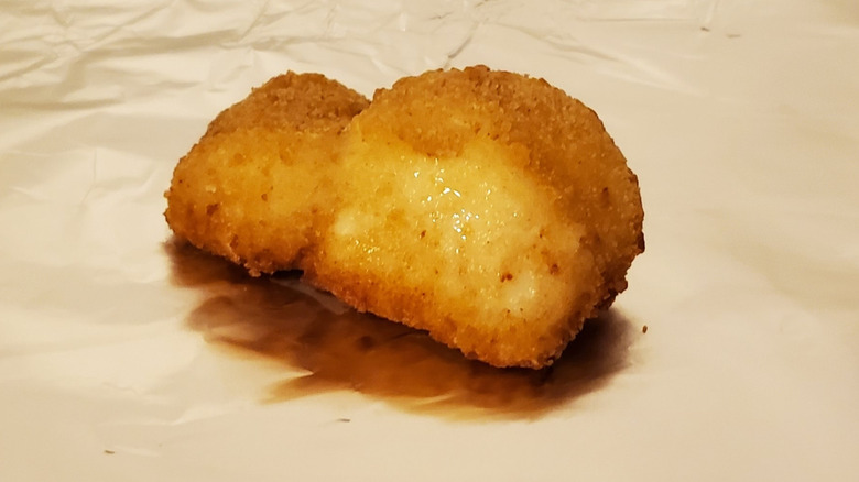 A cod fillet crusted in breadcrumbs