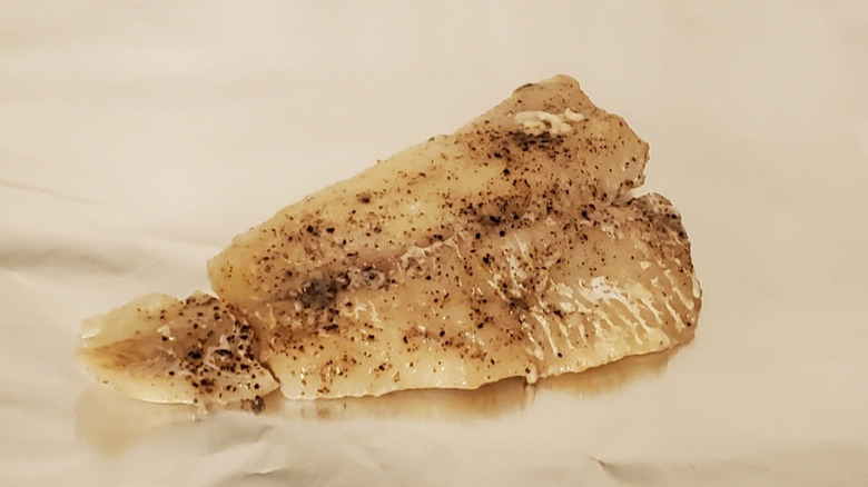 A cod fillet with salt and pepper
