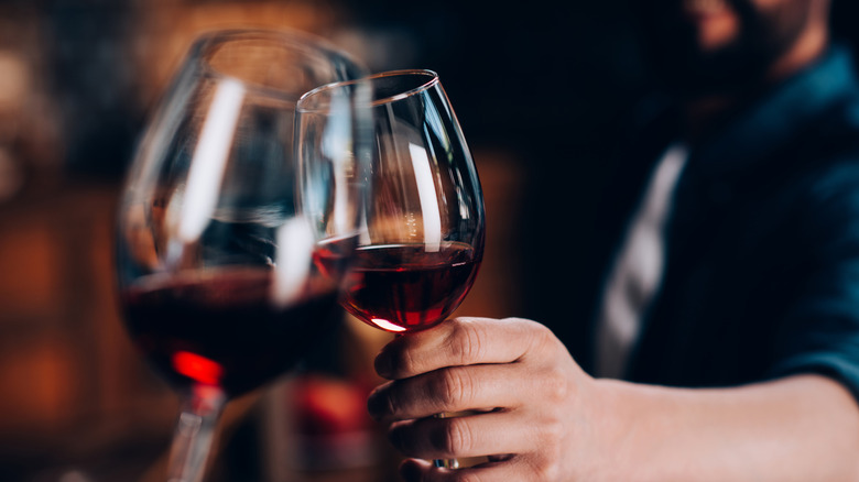 Glasses of wine being clinked