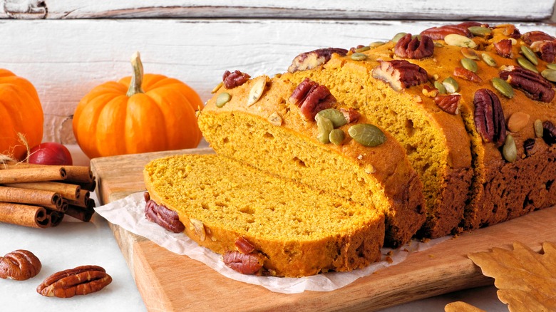 Sliced loaf of pumpkin bread with nuts