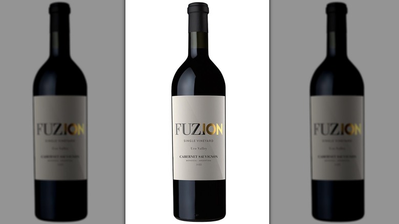 A bottle of Aldi store brand wine called Fuzion Argentina Cabernet Sauvignon.