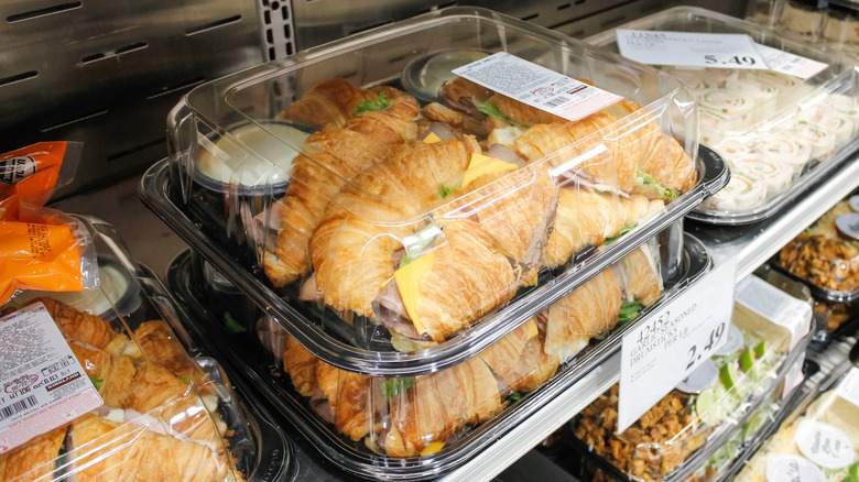 Stack of Costco croissant sandwich platters
