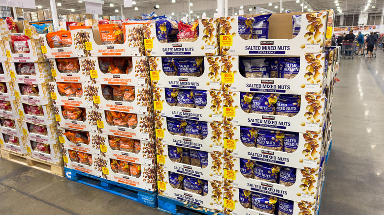 Cardboard display trays with Kirkland Signature mixed nuts stacked on pallets