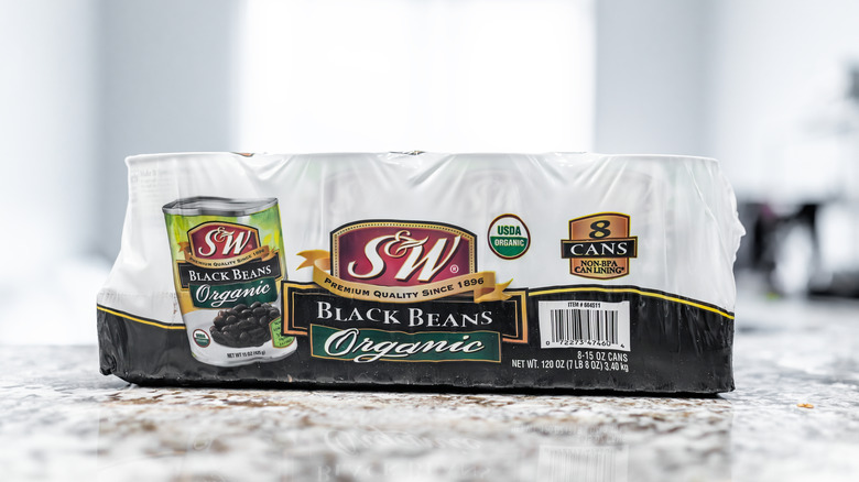 A bulk package of S&W organic black beans sits on a counter