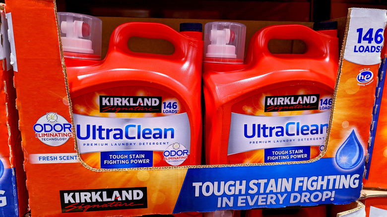 Bottles of Kirkland Signature laundry detergent in a cardboard display tray