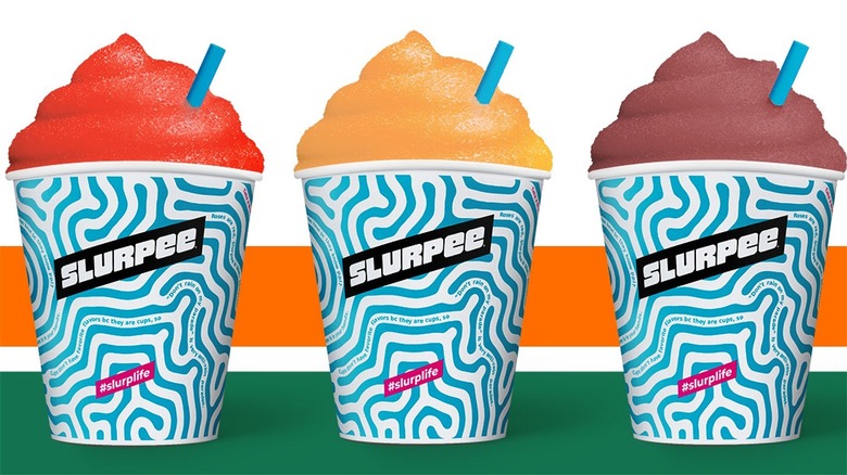 Three small 7-Eleven Slurpees.