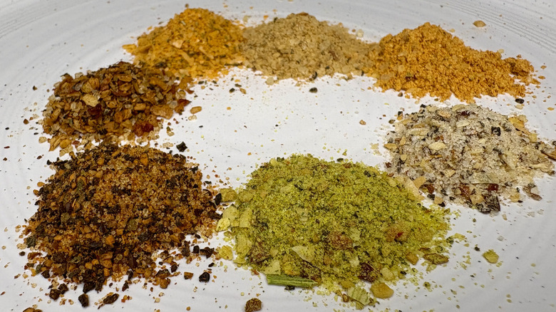Piles of spices on a white plate