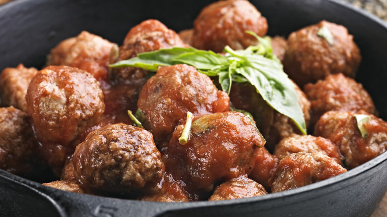cast iron skillet filled with meatballs