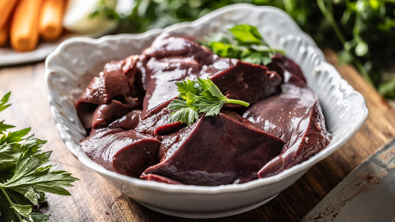 white bowl filled with sliced beef liver
