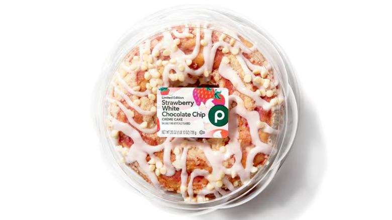 Top view of the Publix strawberry white chocolate chip crème cake in plastic packaging