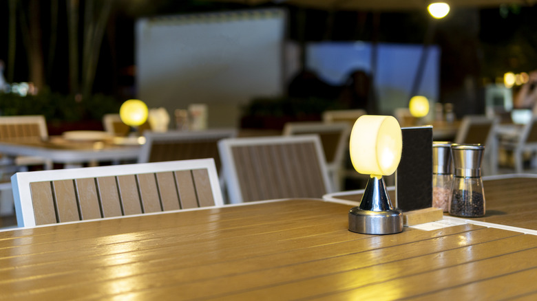 A restaurant table lamp in an empty dining room
