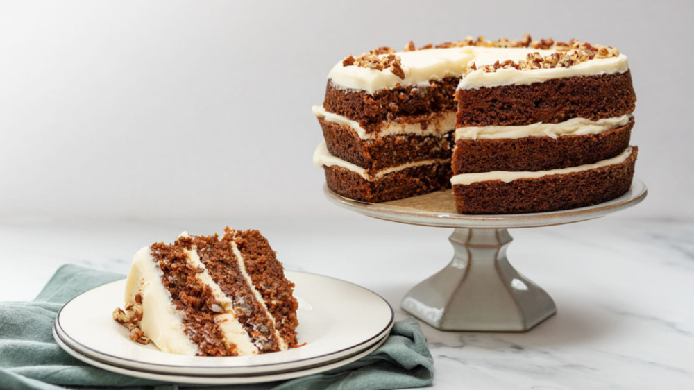 homemade carrot cake on a cake stand