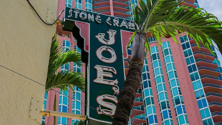 Joe's Stone Crab neon sign outside the building during the day