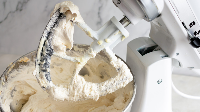 Electric mixer filled with frosting