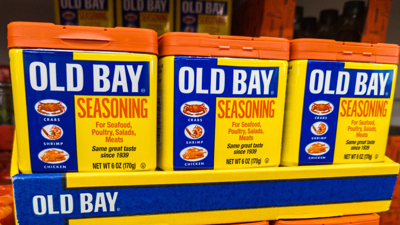 Store shelf filled with Old Bay Seasoning tins