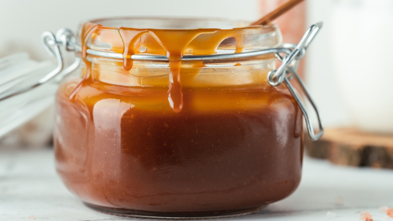 Glass jar of caramel sauce