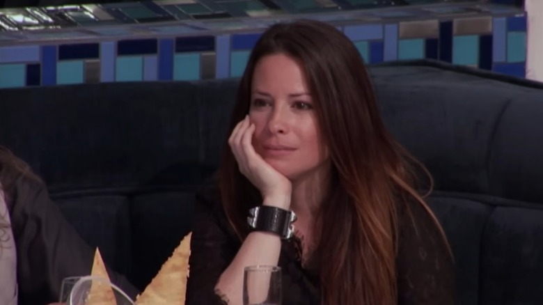 Holly Marie Combs rests her chin on her hand while waiting to be served on "Hell's Kitchen."
