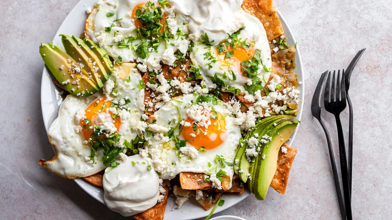 plate with Chilaquiles and forks