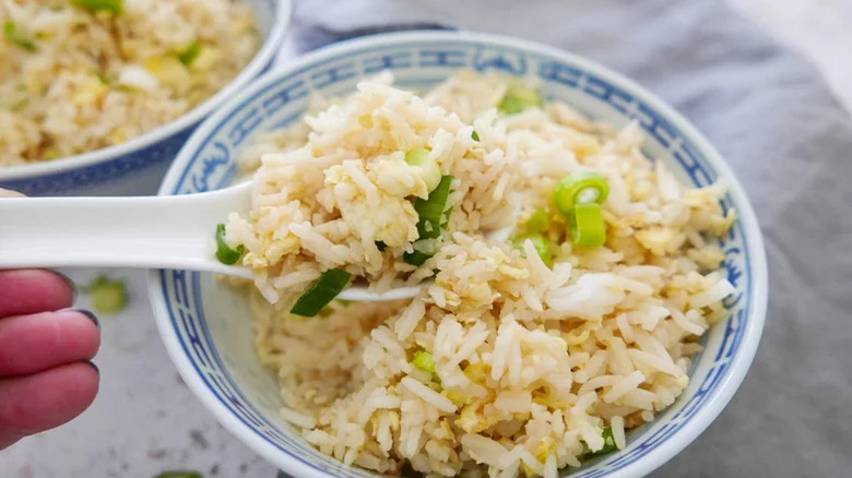 bowl of egg fried rice with spoon