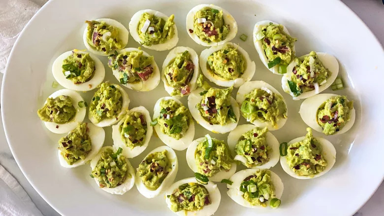 plate with guacamole deviled eggs