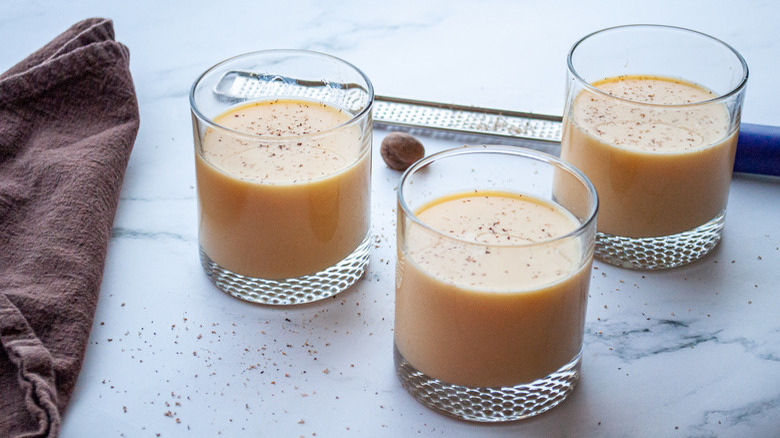 glasses of eggnog with dish towel
