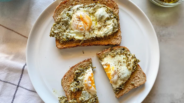 plate with pesto eggs on toast