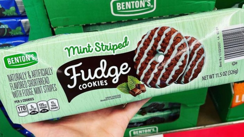 A hand holding a package of Benton's Mint Striped Fudge Cookies