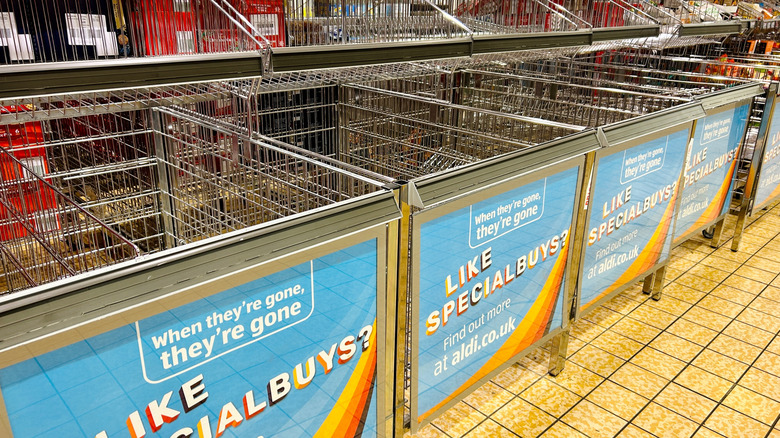 Empty metal baskets for Special Buys at an Aldi supermarket
