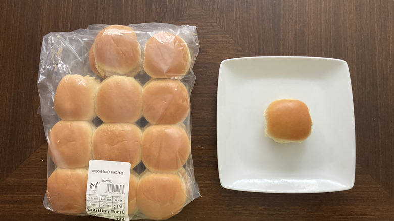 Brioche slider rolls in a bag and one on a plate