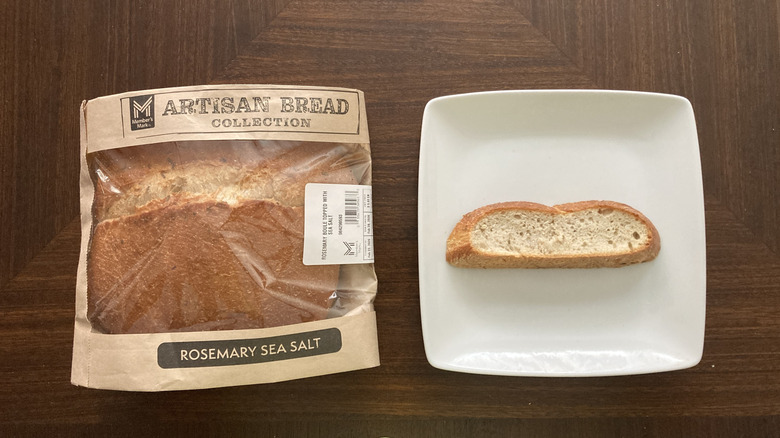 Member's Mark rosemary bread boule in a bag with a slice on a plate