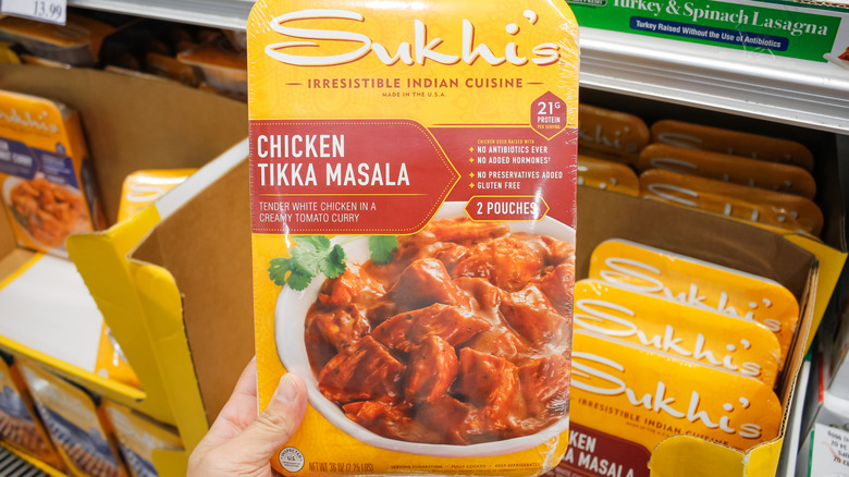 hand holding up package of Sukhi's tikka masala