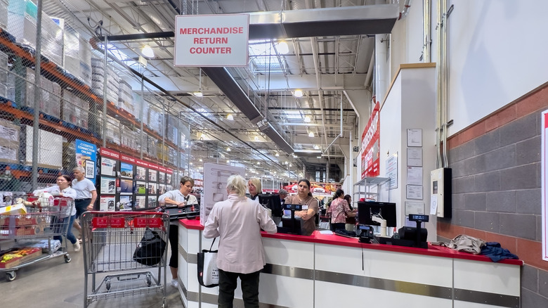 Returns desk at Costco with customers standing by