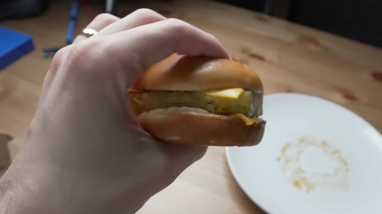 hand holding pineapple based McDonald's Hula Burger
