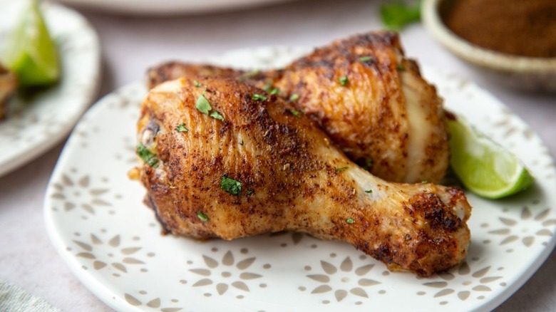 chicken legs on patterned plate