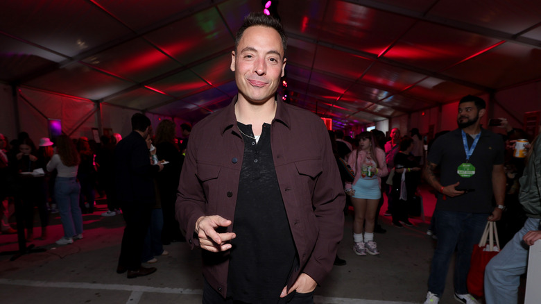 Jeff Mauro smirking at the camera at a Food Network event