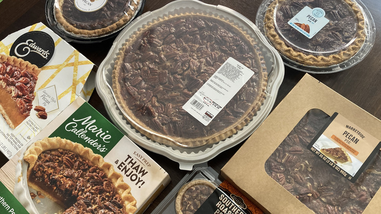 A variety of store bought pecan pies in packaging